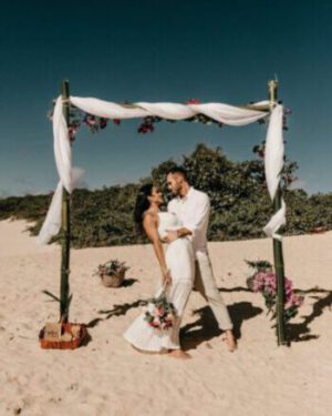 bride and groom on sand beach