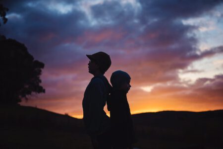 silhouette photography of two children s